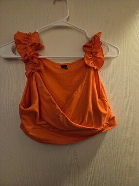 Orange ruffle shoulder crop top with ruffle bottoms